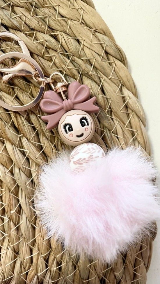 Popje roze met strik